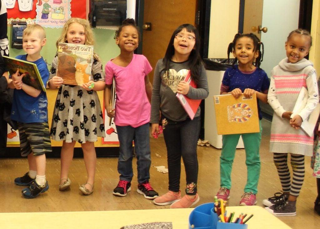 Kindergarteners waiting to visit the school library. 